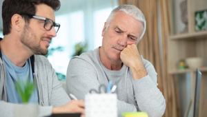 father and son on laptop