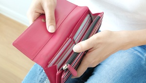 woman looking in purse