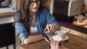 woman paying by credit card