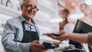 man paying by credit card