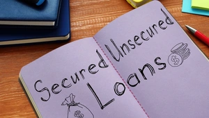 Secured and unsecured loans written in a notebook