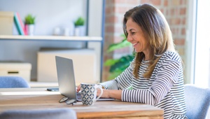smiling woman on laptop