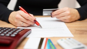 Woman looking at credit card bill