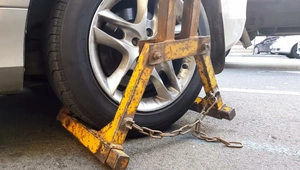 Car with wheel clamped