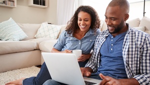 couple looking on a laptop