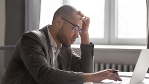 frustrated man on laptop