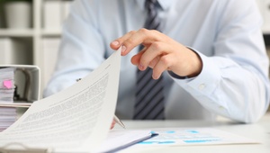 businessman checking paperwork