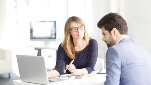 man at bank speaking to an adviser