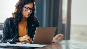 woman researching on laptop