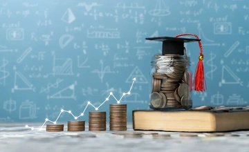 Jar of coins with a student graduation hat on