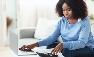 Woman on a laptop going through her finances
