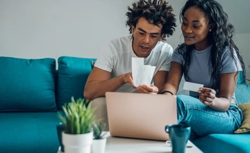 Young couple looking through accounts together