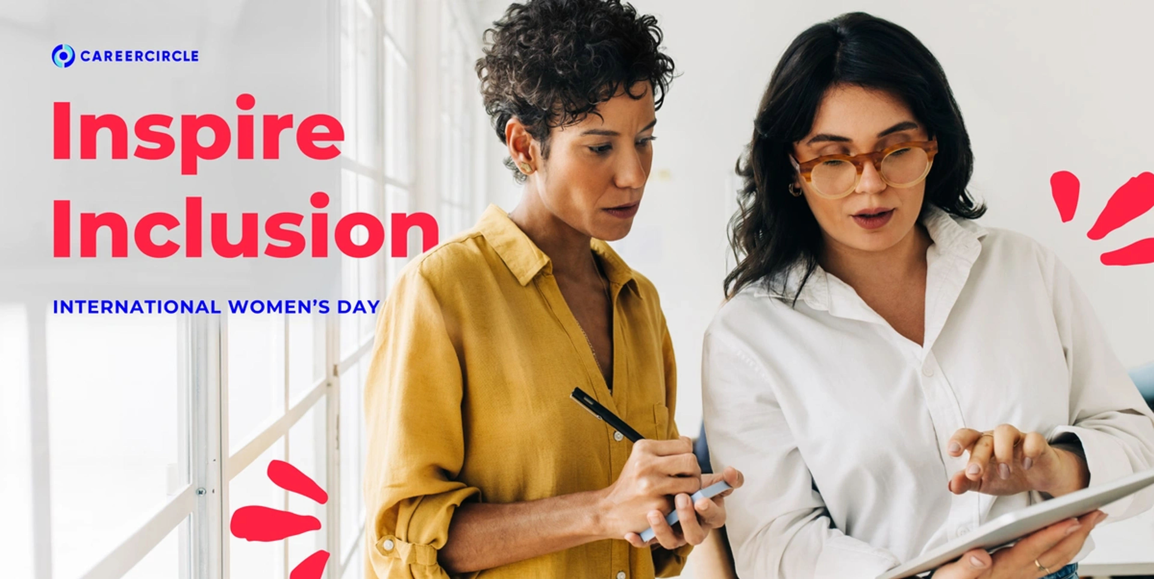Two women staring at a piece of paper with the text inspire inclusion, international women's day