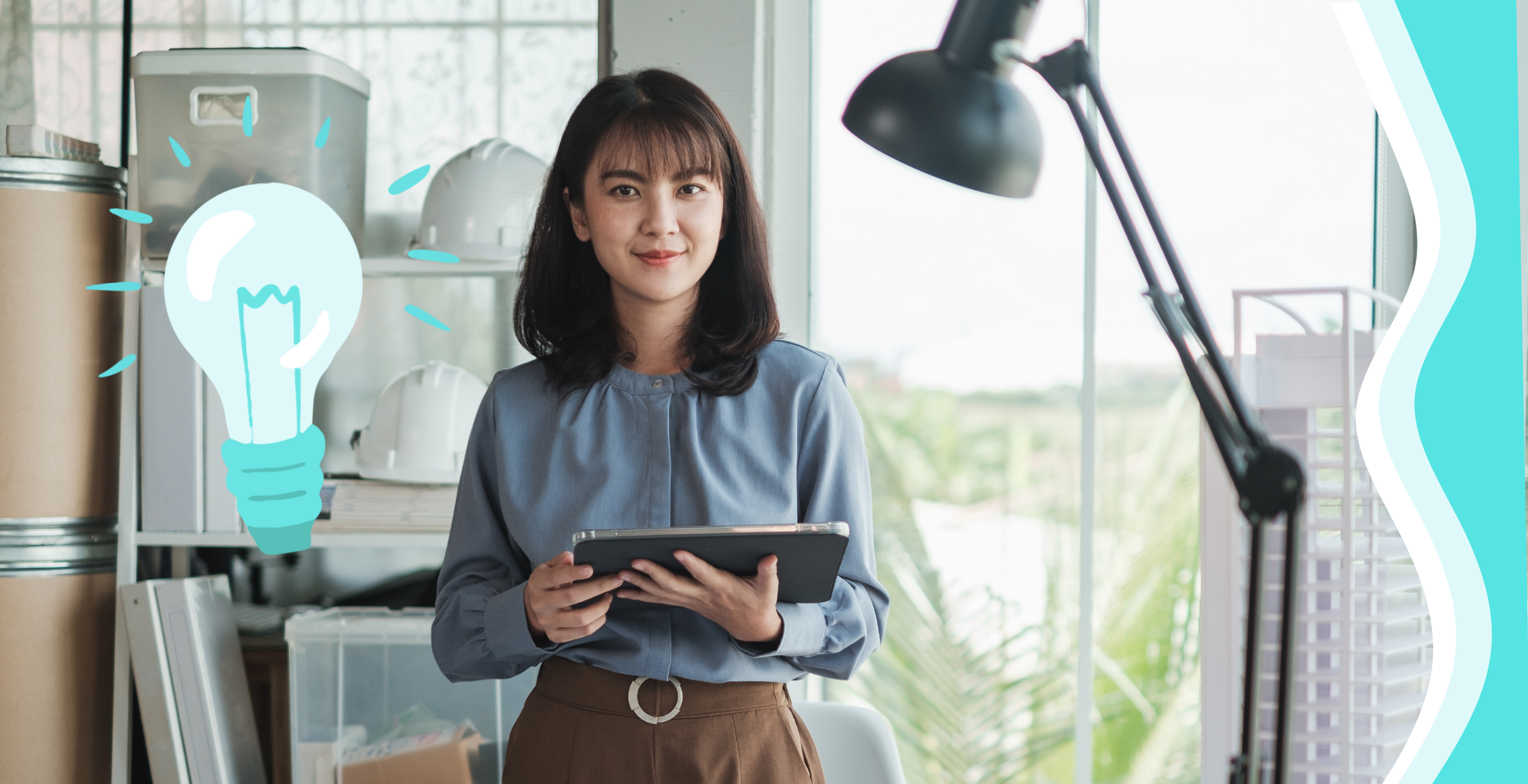 woman with tablet looking at the screen with a blue lightbulb next to her