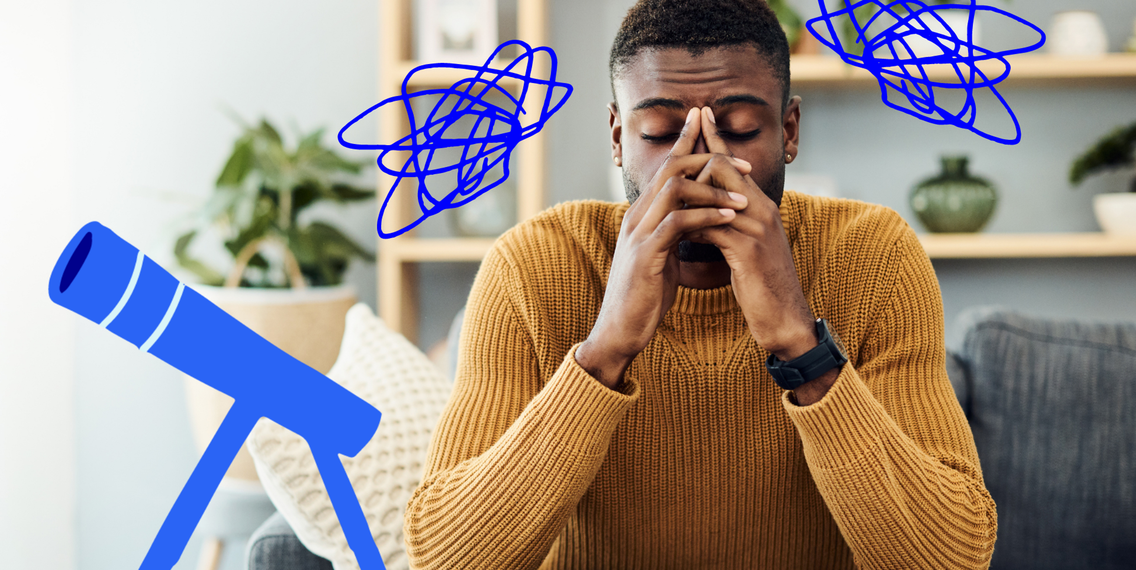 black man sitting down and looking stressed with his hands on his face