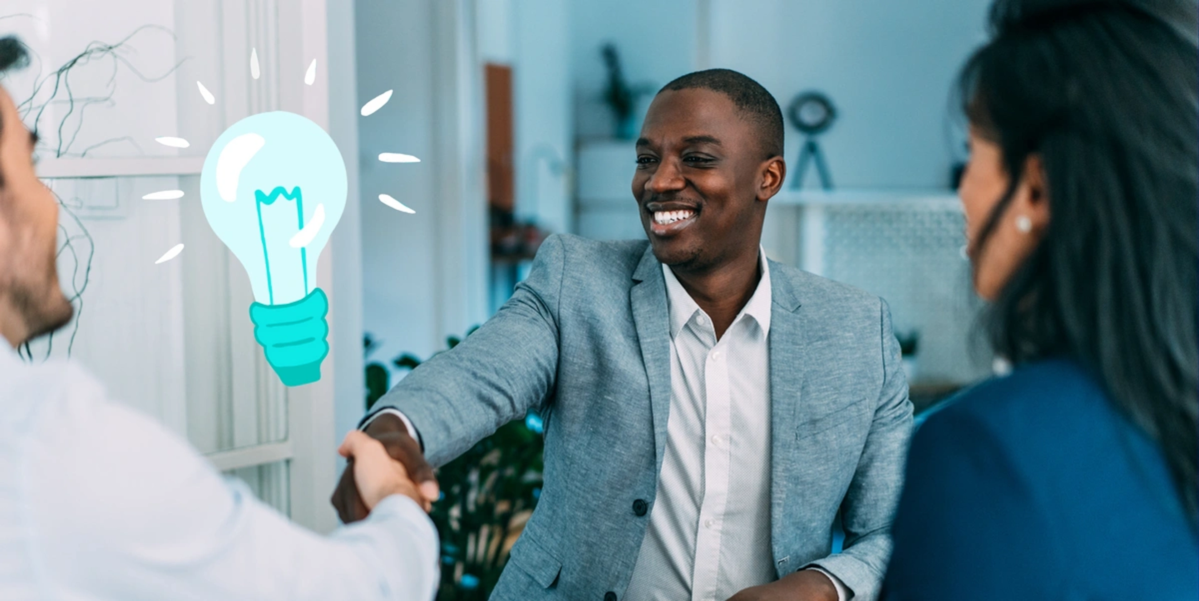 Featured Image - black man shaking another man's hand with blue lightbulb in background s