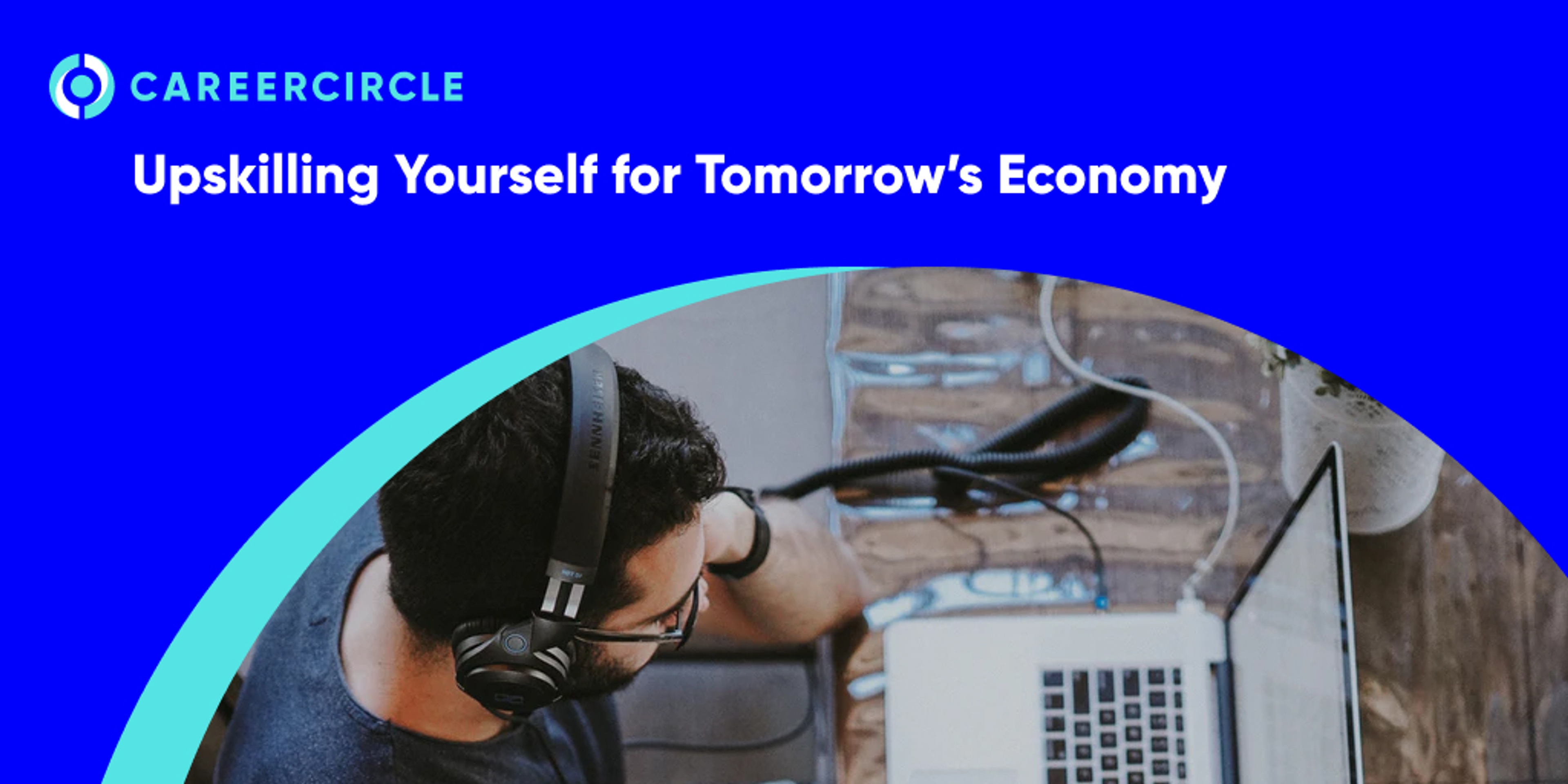 CareerCircle - "Upskilling Yourself for Tomorrow's Economy" image of a man wearing headphones sitting at his computer