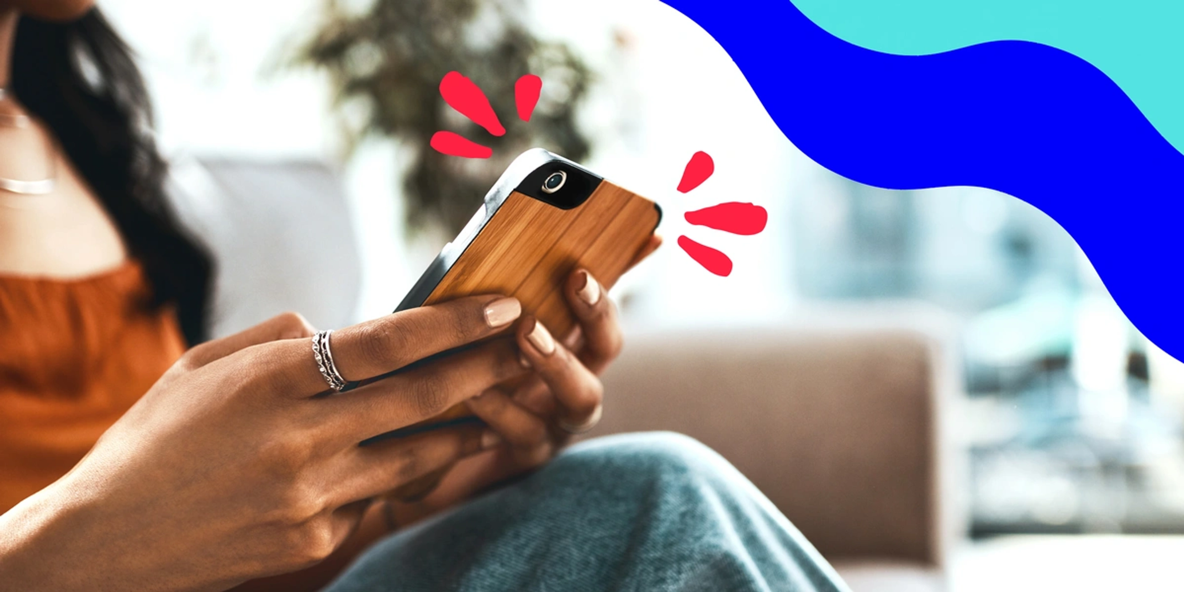 woman holding an iphone with a wood case on it, framed by red and blue lines