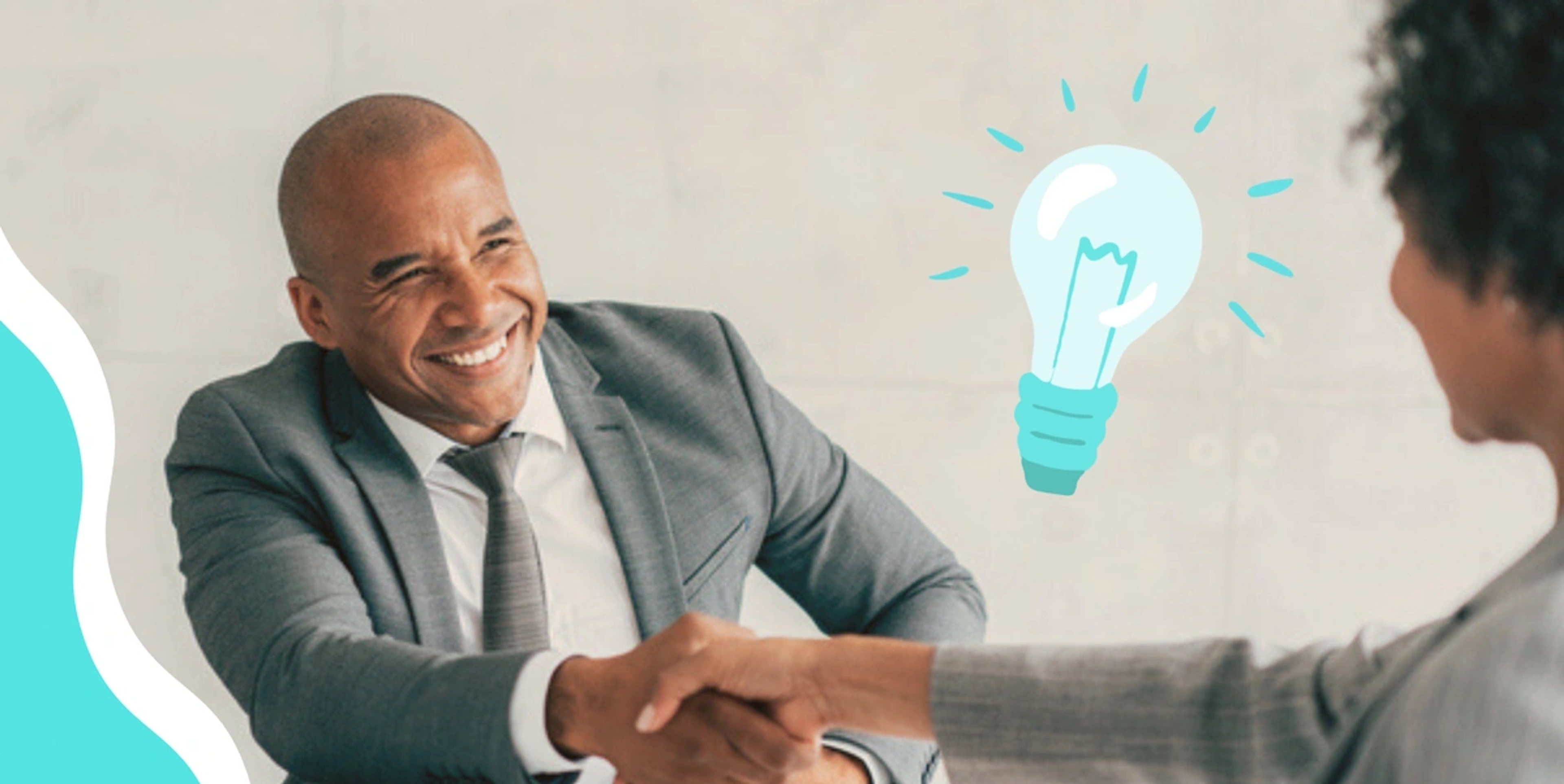 black man shaking a woman's hand with a blue lightbulb in the backgrounf