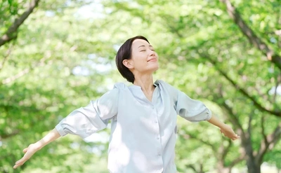 Woman in woods breathing