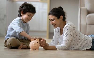 Parent and child with piggy bank