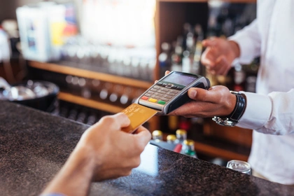 woman paying using credit card
