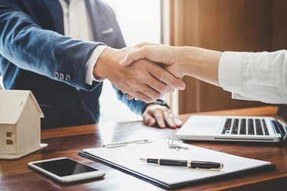 two businesspeople shaking hands
