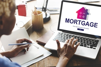 woman looking at mortgages on a computer