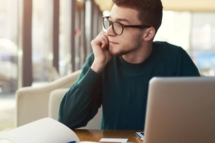 Man looking pensive on laptop