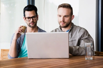 two men on laptop
