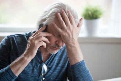 stressed man on phone