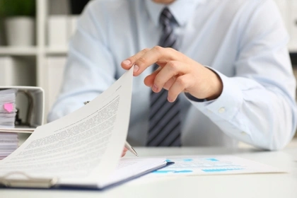 businessman checking paperwork