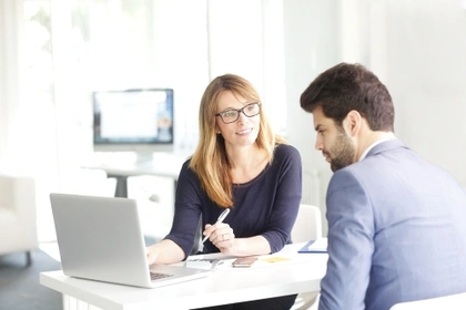 man at bank speaking to an adviser