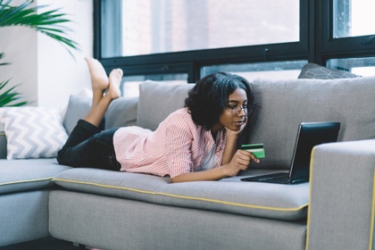 woman paying for something online with credit card