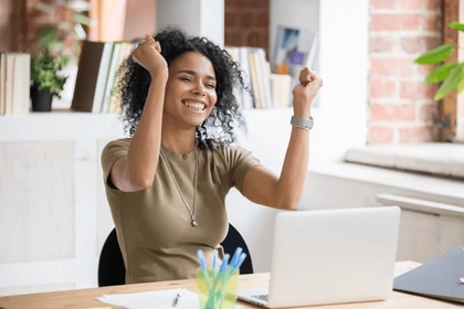 Young lady with laptop applying for a loan.