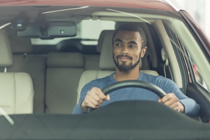 Man driving his car.