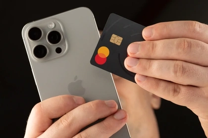 Close up of an iphone and Mastercard credit card