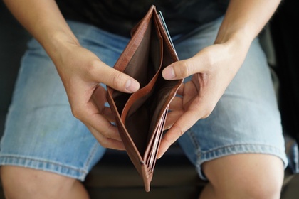 man with empty wallet