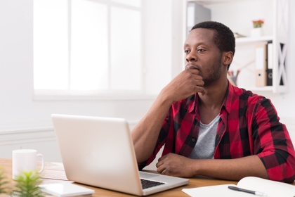 serious man on laptop