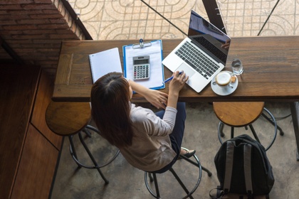 woman in cafe on laptop