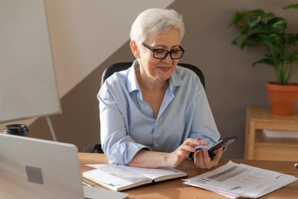 Woman using a calculator