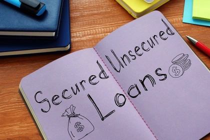 Secured and unsecured loans written in a notebook
