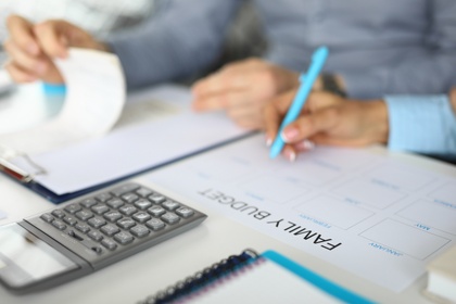 couple planning budget on calendar