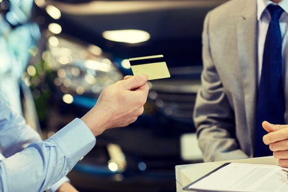 man handing over a credit card