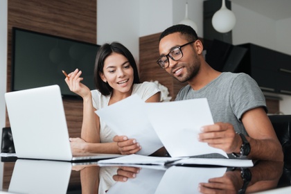 couple looking at paperwork together