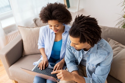 Couple researching loans on the internet