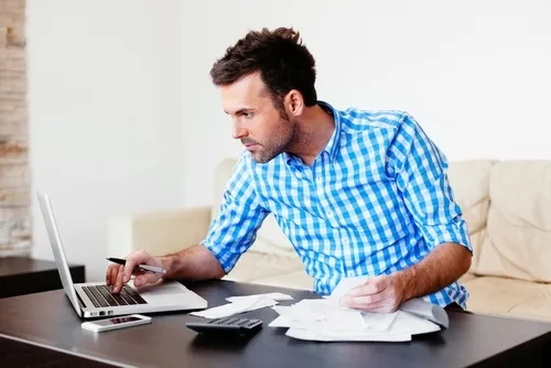 man checking finances