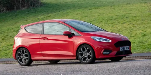 Red Ford Fiesta parked up