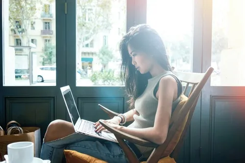 Woman checking her credit score on laptop