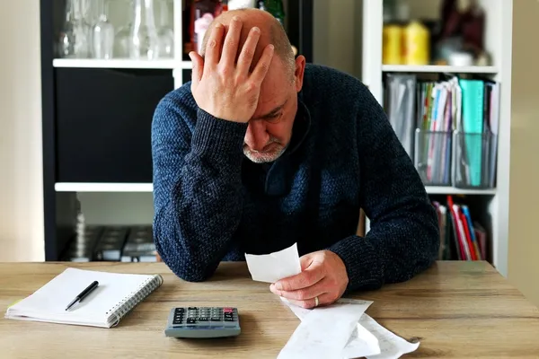 Man looking at energy bill